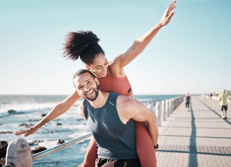 Couple enjoying an active outdoor lifestyle after weight loss treatment