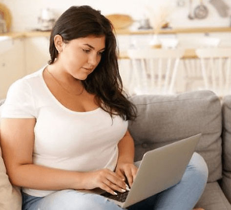 Woman researching weight loss treatment options on her laptop