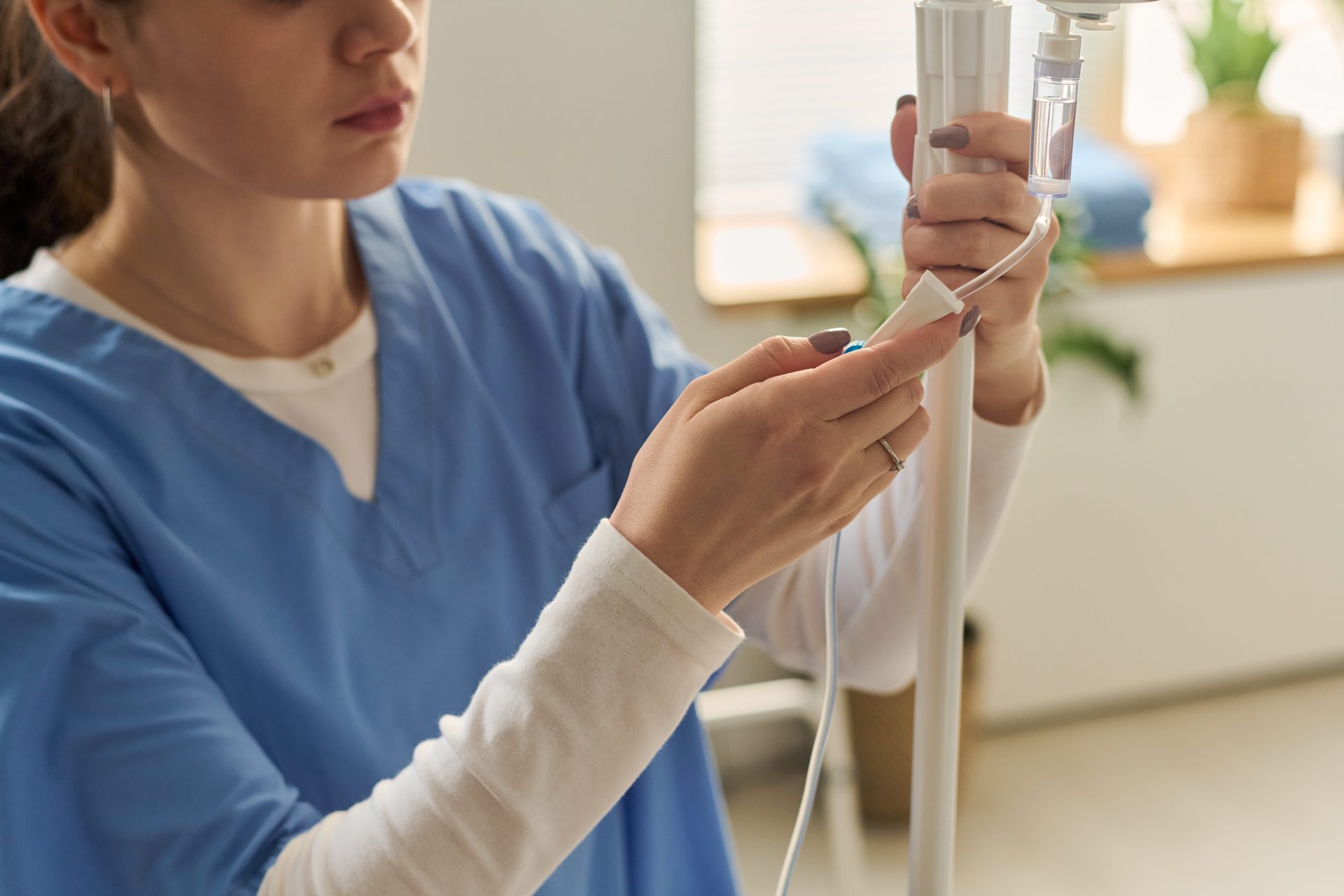 Woman drinking water to stay hydrated after physical activity