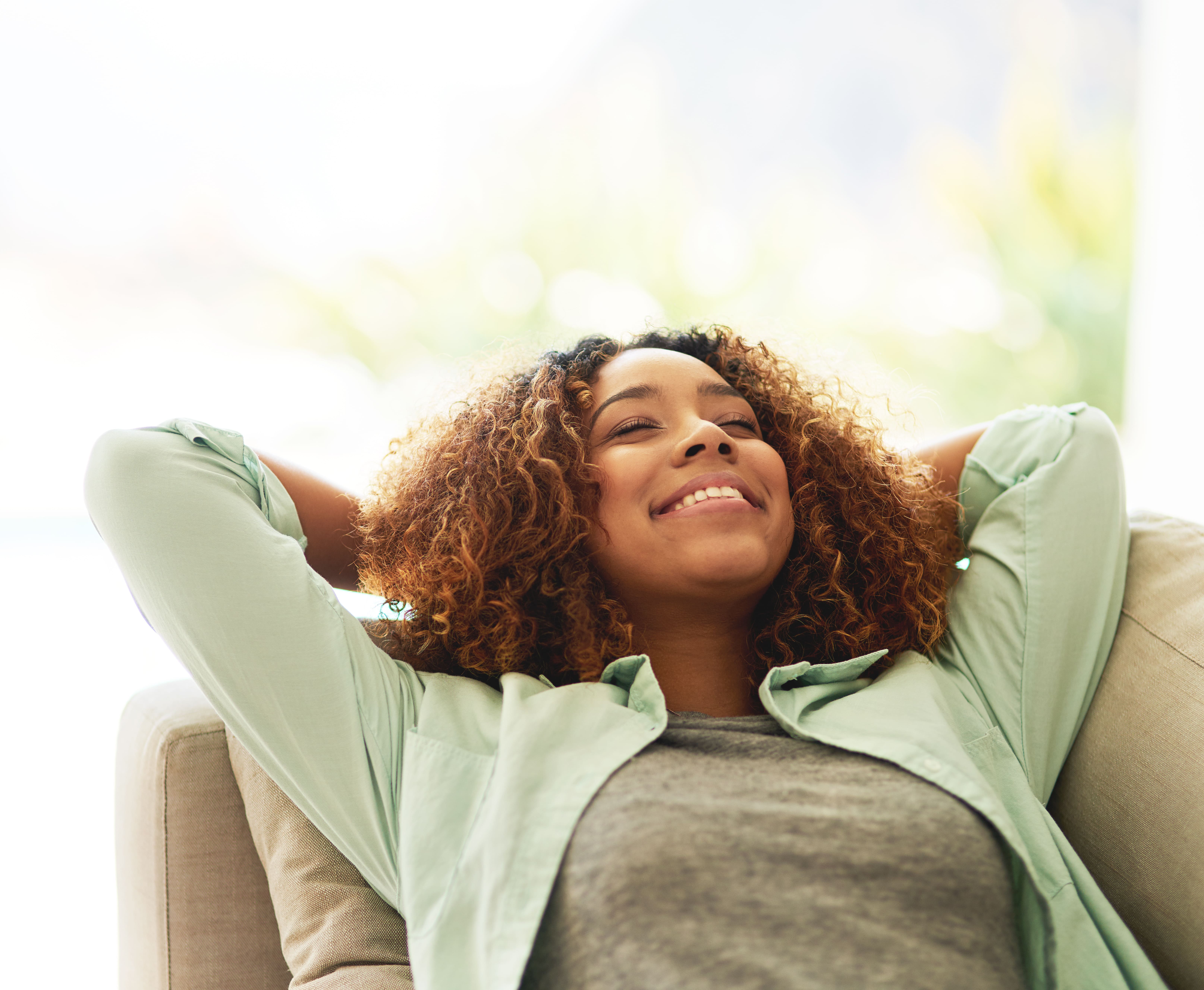 Woman relaxing comfortably at home
