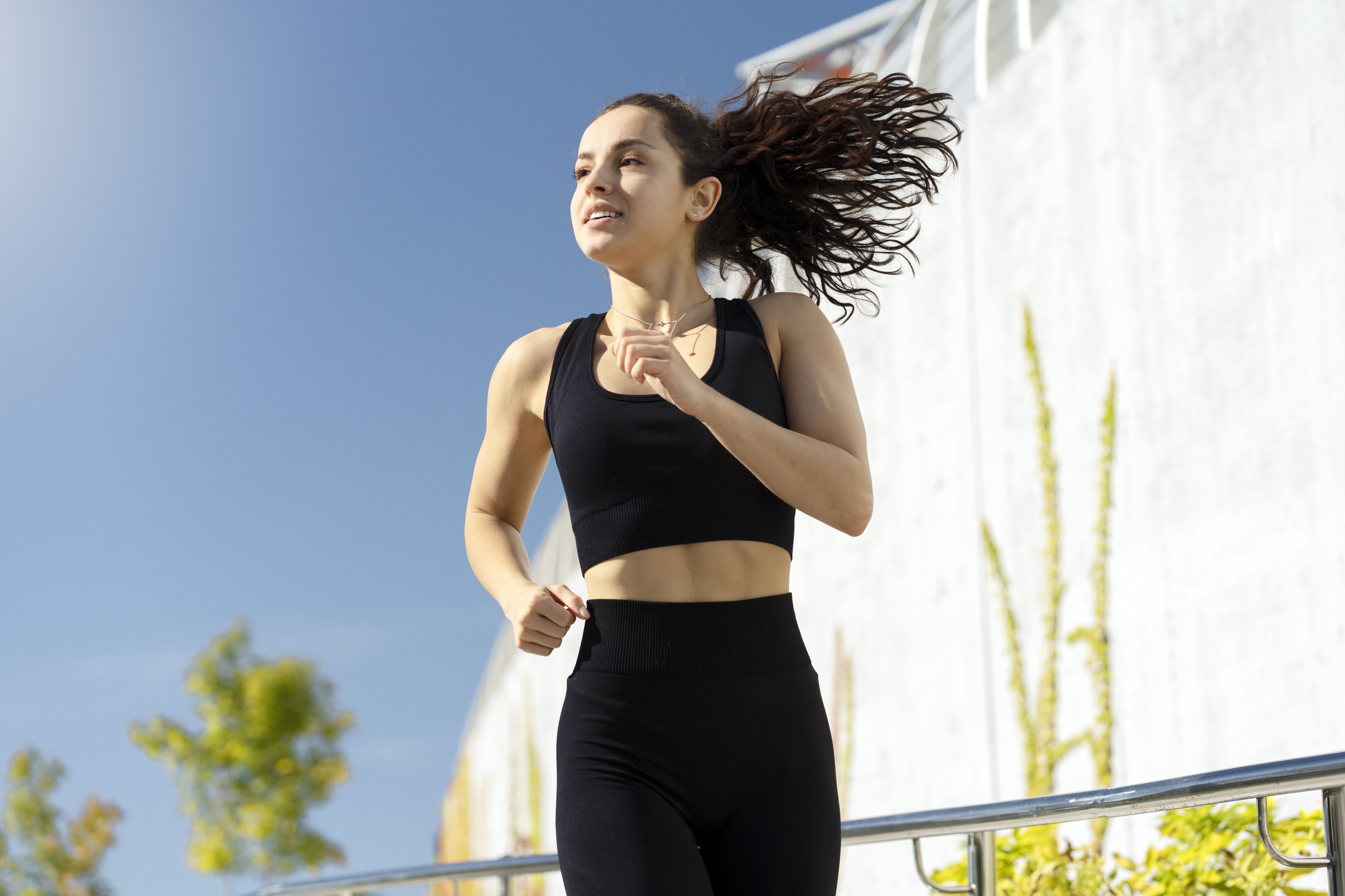 Young woman running outdoors
