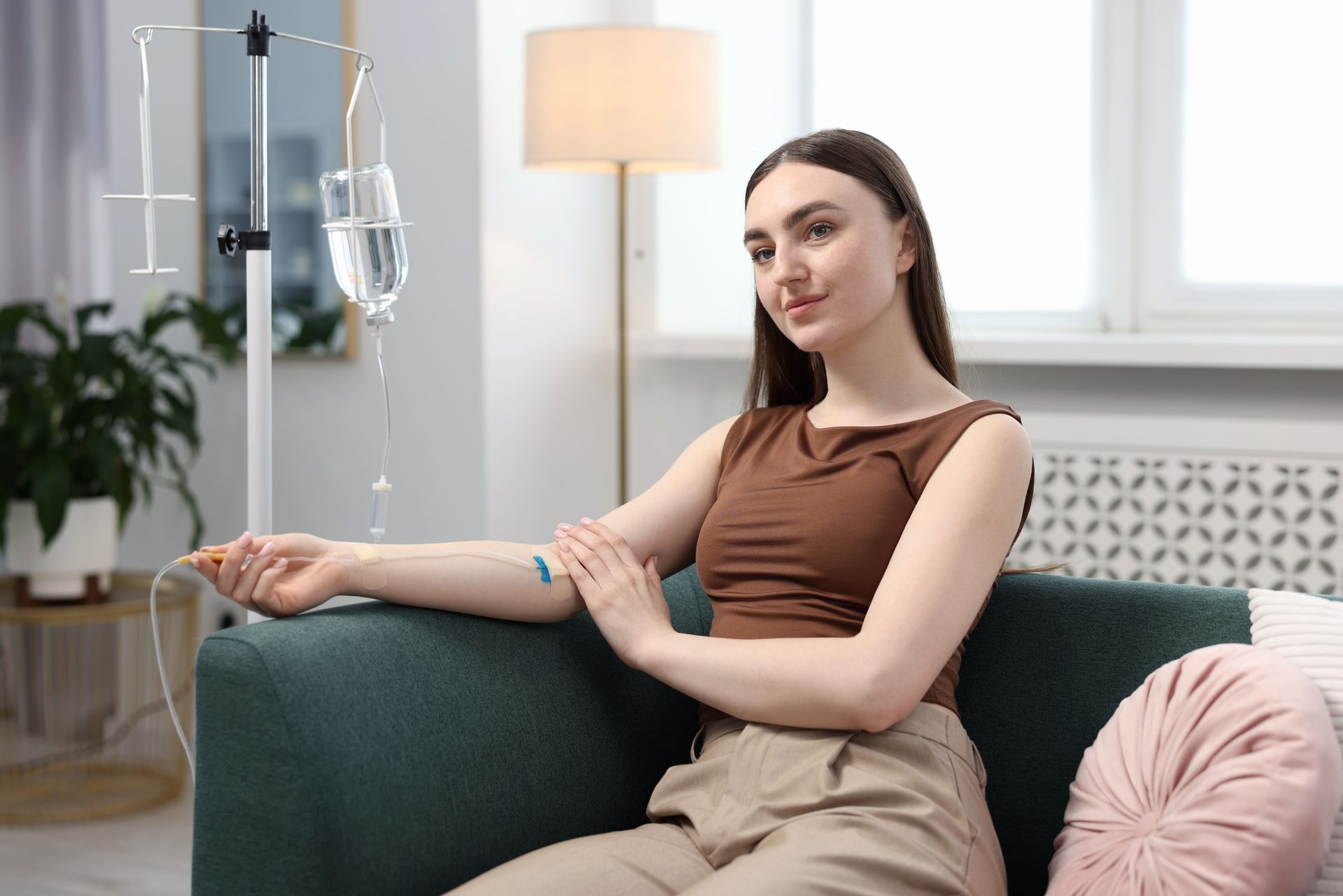 Woman drinking water to stay hydrated after physical activity